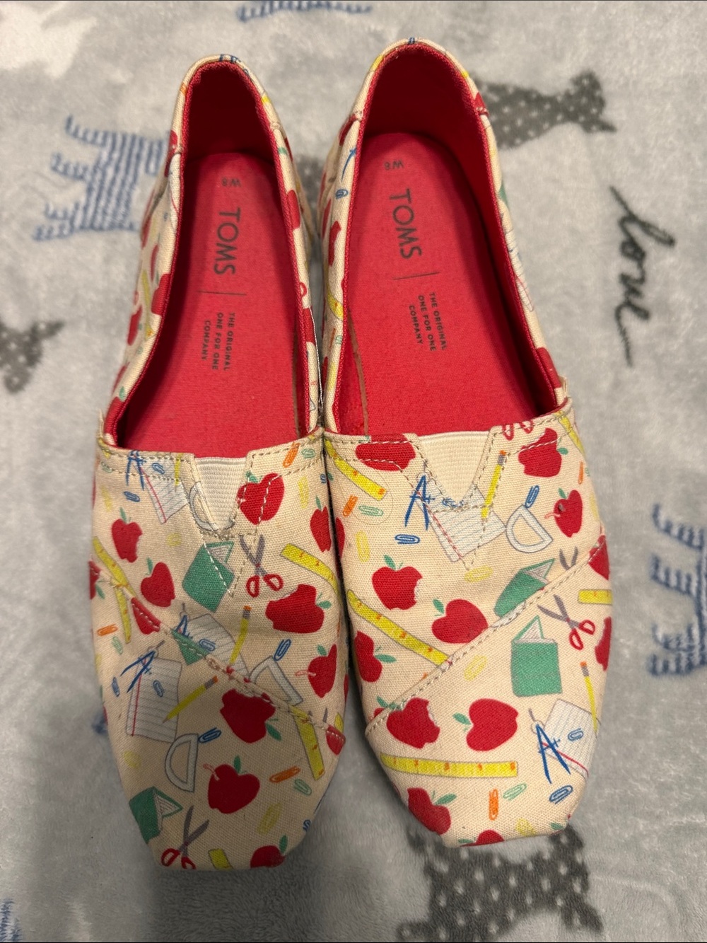 TOMS Women’s Canvas Slip-Ons with Red Apple & School Supply Print